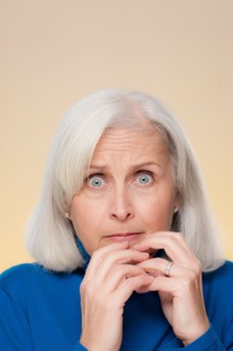 Studio shot of worried senior woman. Photo : Rob Lewine