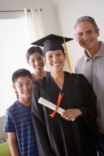 Family celebrating mother's graduation. Photo : Rob Lewine