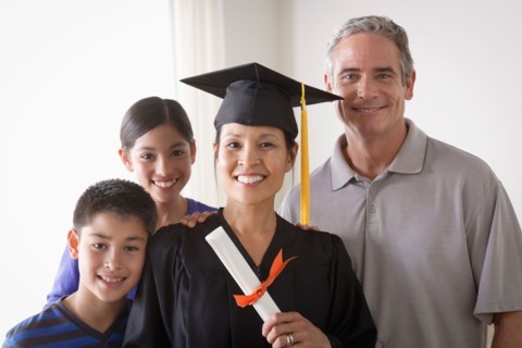 Family celebrating mother's graduation. Photo : Rob Lewine