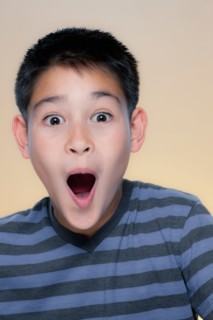 Portrait of boy with astonished expression. Photo : Rob Lewine