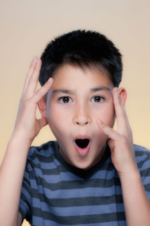 Portrait of boy making facial expression. Photo : Rob Lewine