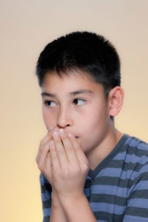 Portrait of scared boy. Photo : Rob Lewine
