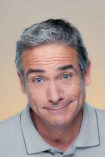 Studio Portrait of mature man smiling. Photo : Rob Lewine
