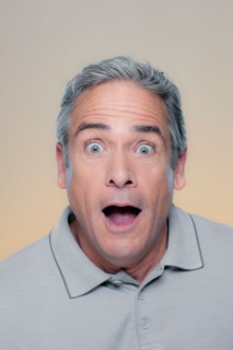 Studio Portrait of mature man looking surprised. Photo : Rob Lewine