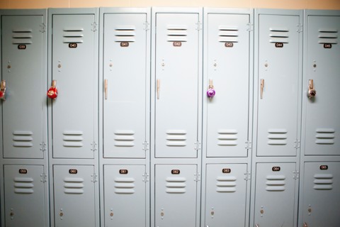 Row of lockers with different padlocks. Photo : Jessica Peterson