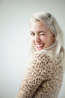 Young attractive woman blinking in front of camera. Photo : Jessica Peterson