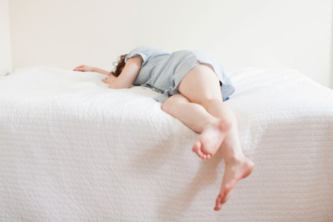 Attractive young woman sleeping in bed. Photo : Jessica Peterson