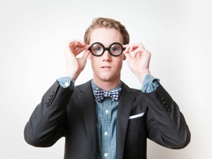 Studio shot of young man wearing funny glasses. Photo : Jessica Peterson