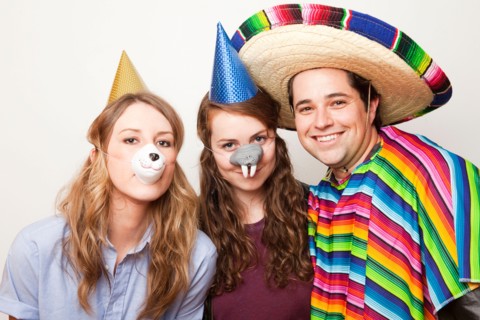 Studio Shot of three people dressed up in animal noses and sombrero. Photo : Jessica Peterson