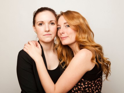 Studio Shot portrait of young women embracing. Photo : Jessica Peterson