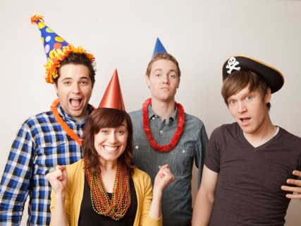 Studio Shot of young people dressed up in party hat. Photo : Jessica Peterson