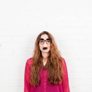 Studio Shot portrait of young woman in artificial nose. Photo : Jessica Peterson