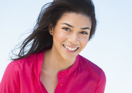 Portrait of young woman smiling.