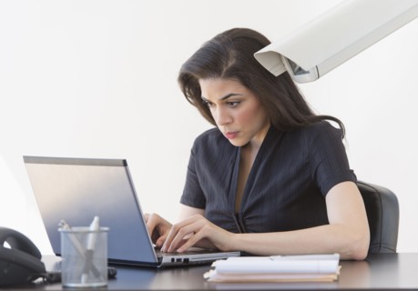 Businesswoman spied on by cctv camera.
