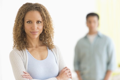 Portrait of couple with focus on woman in foreground.