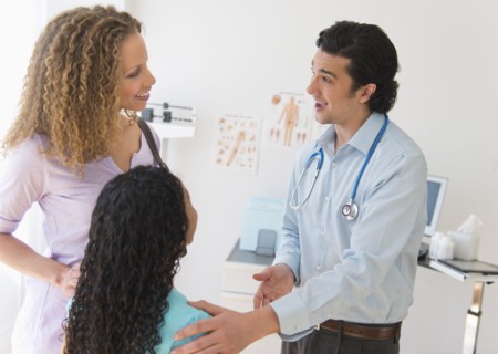 Mother with daughter (12-13) visiting pediatrician.