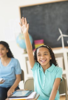 Schoolgirl (10-13) raising hand.