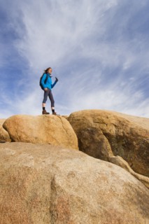 USA, California, Joshua Tree National Park, Female hiker on rocks.