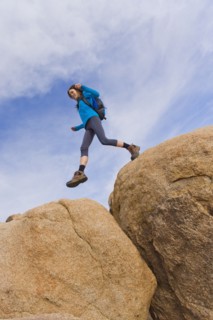 USA, California, Joshua Tree National Park, Female hiker on rocks.