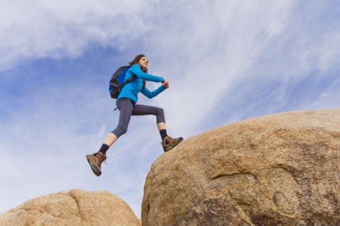 USA, California, Joshua Tree National Park, Female hiker on rocks.