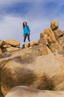 USA, California, Joshua Tree National Park, Female hiker on rocks.