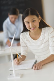 Portrait of female student (14-15) at school.