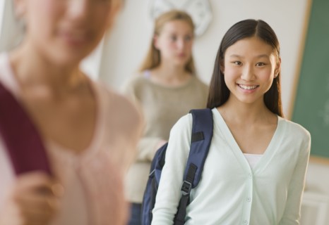 Students (14-19) in classroom.