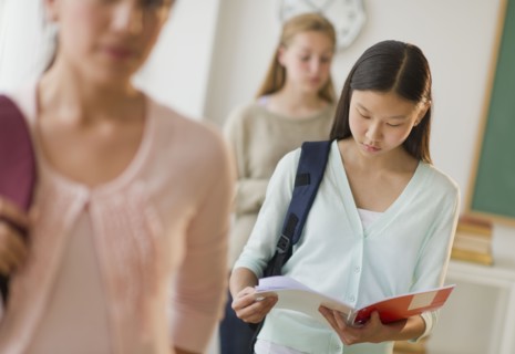 Students (14-19) in classroom.