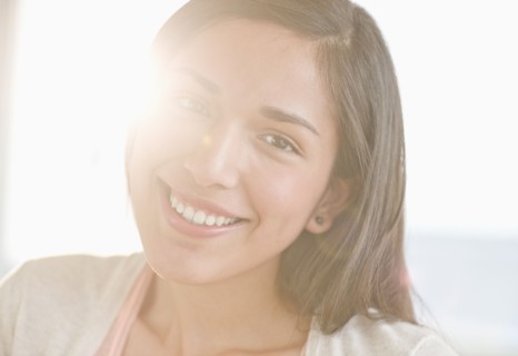 Portrait of young woman smiling.