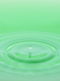 Drop falling into water.