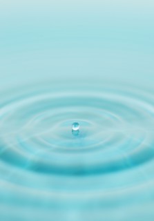 Drop falling into water.