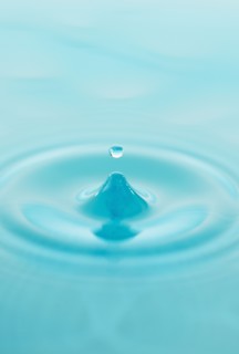 Drop falling into water.