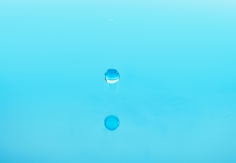 Drop falling into water.