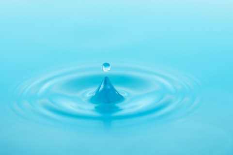 Drop falling into water.