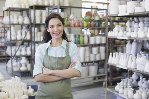 Woman in pottery warehouse.