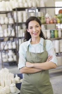 Woman in pottery warehouse.