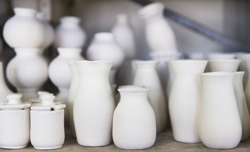 USA, New Jersey, Jersey City, Pottery on shelves.