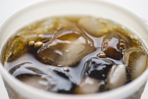 Close-up of soda in disposable cup. 
Photo : Jamie Grill