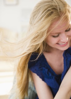 Woman laughing. 
Photo : Jamie Grill