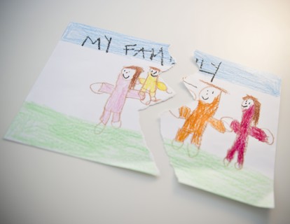 Torn child's drawing depicting family. 
Photo : Jamie Grill