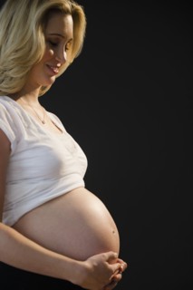 Portrait of pregnant woman. 
Photo : Jamie Grill