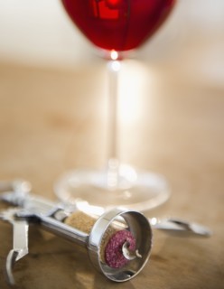 Corkscrew and glass of wine. 
Photo : Jamie Grill