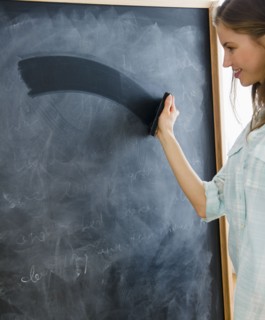 Woman erasing blackboard. 
Photo : Jamie Grill