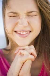 Close-up of praying woman. 
Photo : Jamie Grill