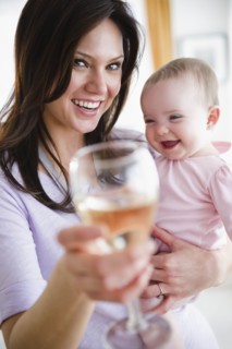 Mother with baby daughter (6-11 months) making toast. 
Photo: Jamie Grill