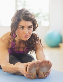 Woman practicing yoga. 
Photo : Daniel Grill