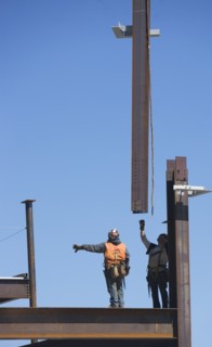 Construction workers on construction frame. 
Photo : fotog