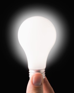 Close-up of lit light bulb. 
Photo : Mike Kemp