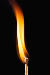 Close-up of burning match. 
Photo : Mike Kemp