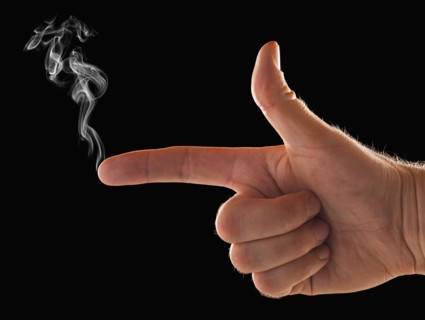 Male hand with smoke coming out of index finger. 
Photo: Mike Kemp